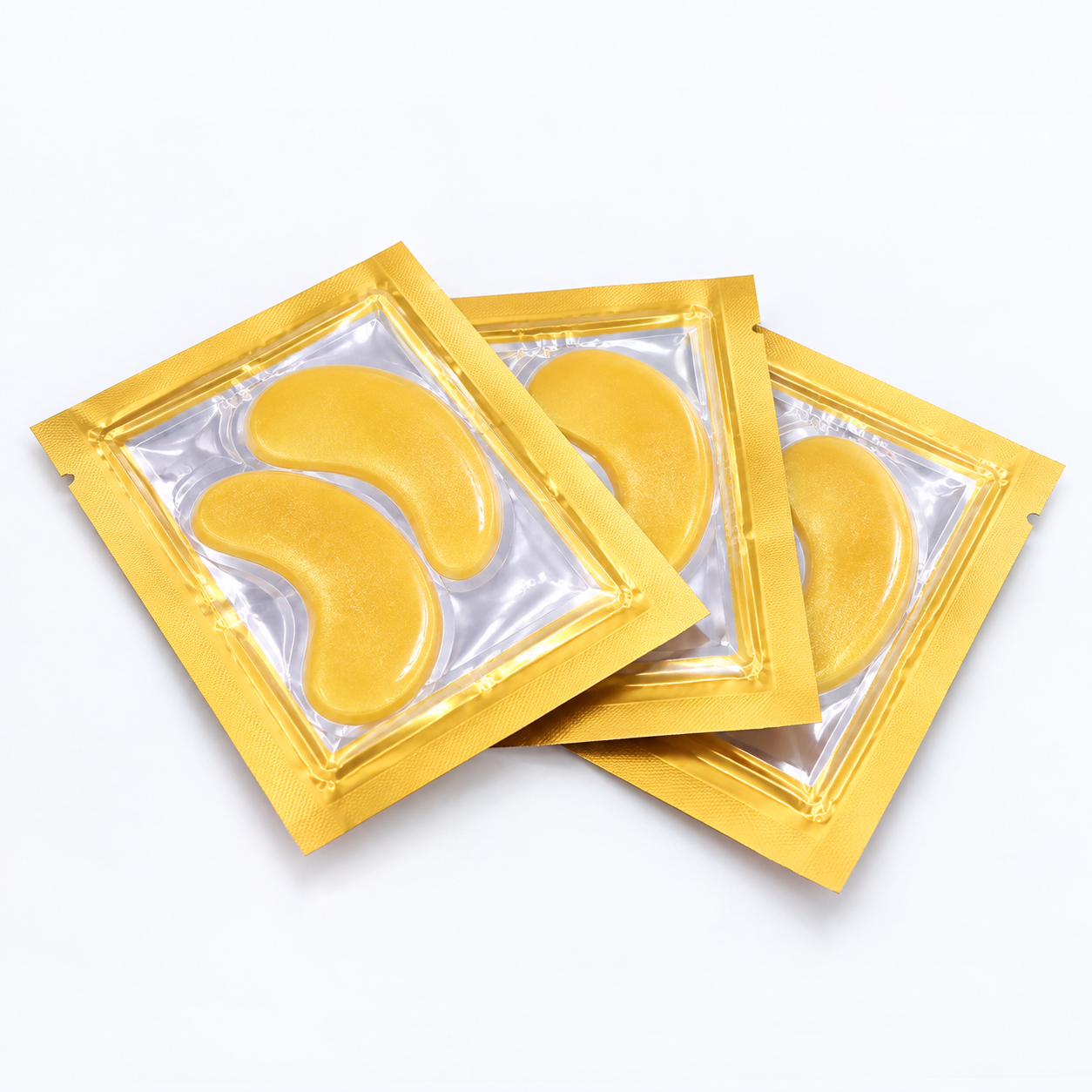 Three individually sealed 24K gold eye mask sachets